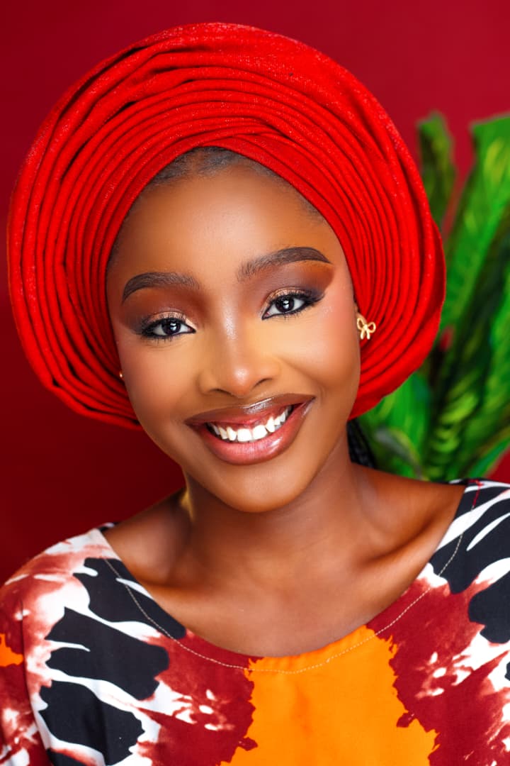 Smiling portrait, red wall